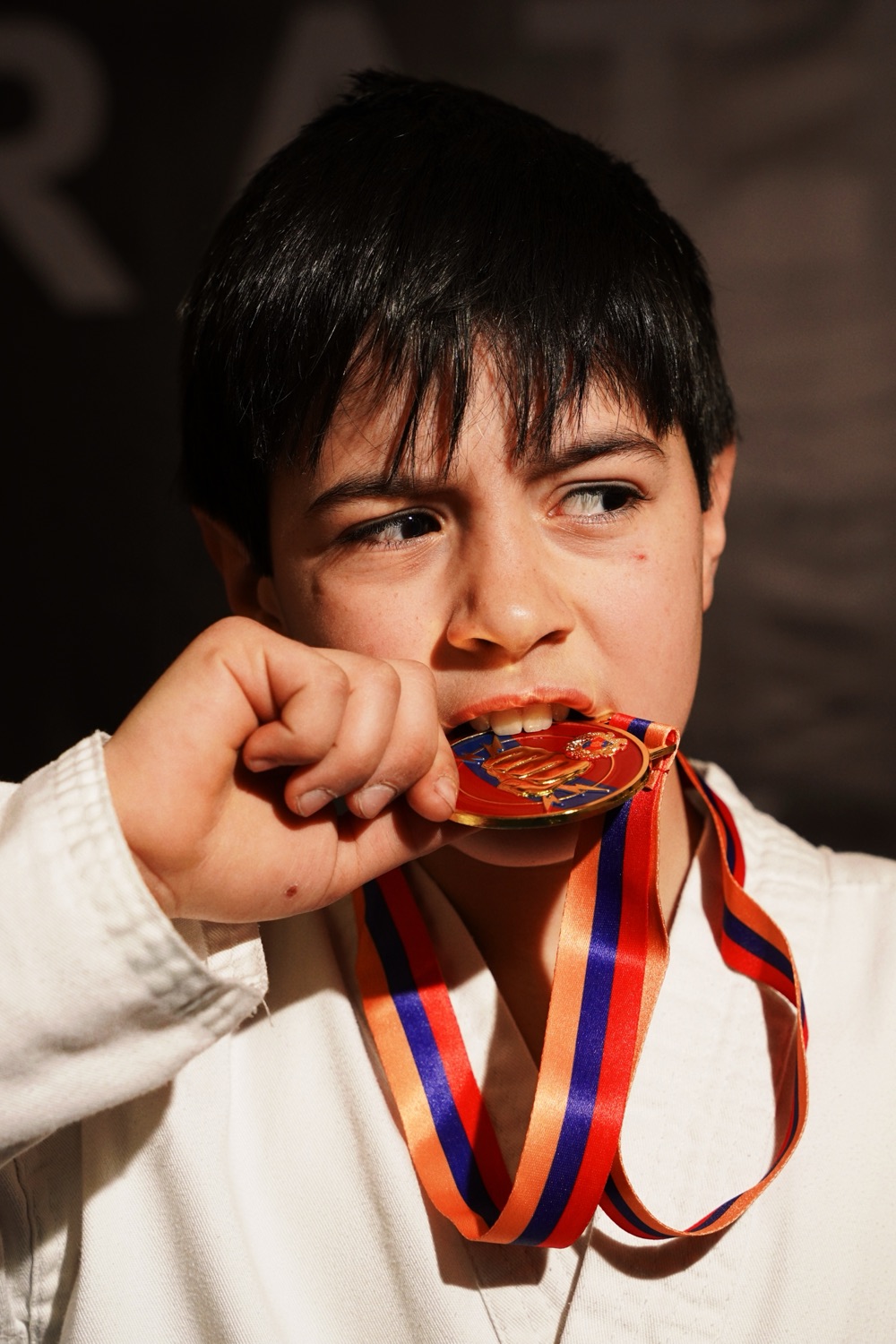 Student with his medal after a tournament
