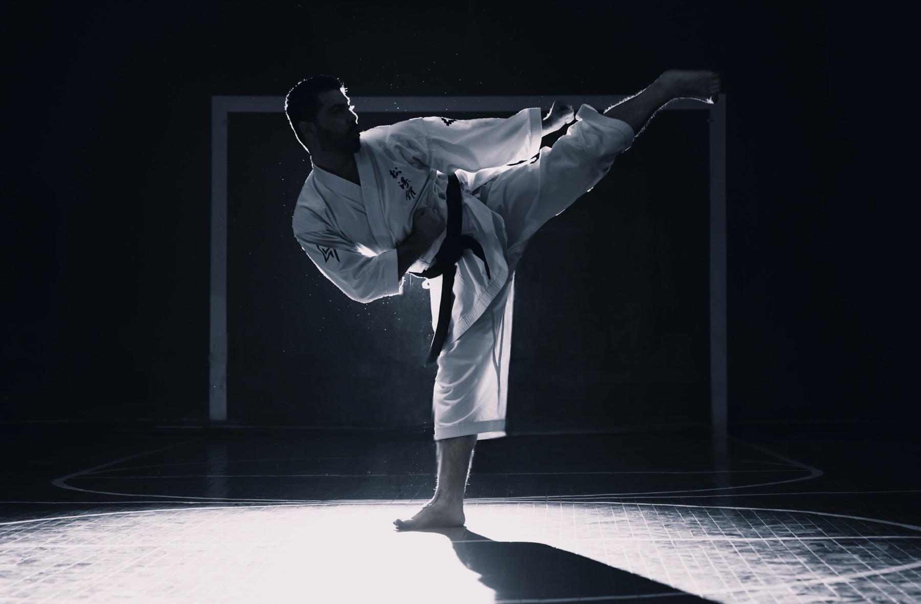 Coach performing a high kick