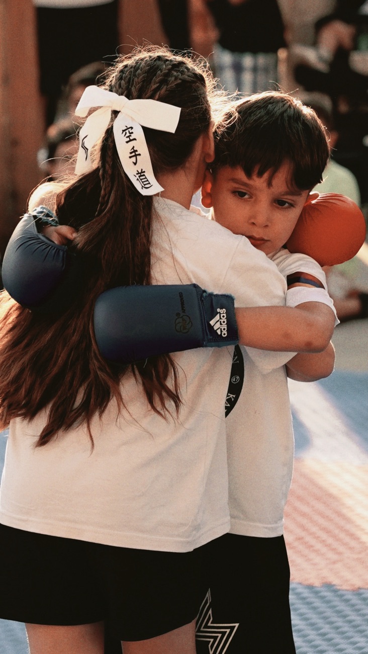 Students hugging after training