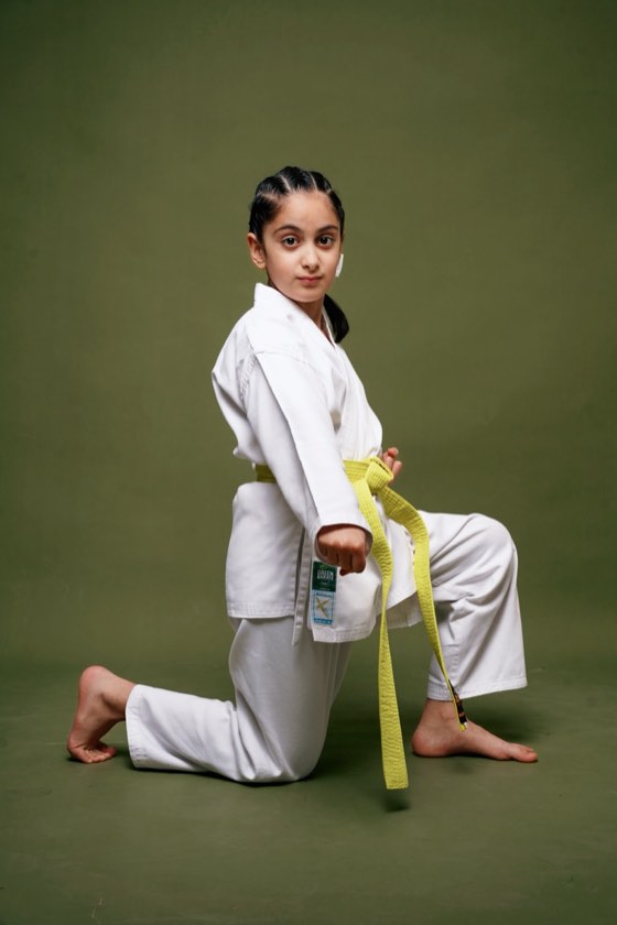 Yellow-belt student in a karate stance