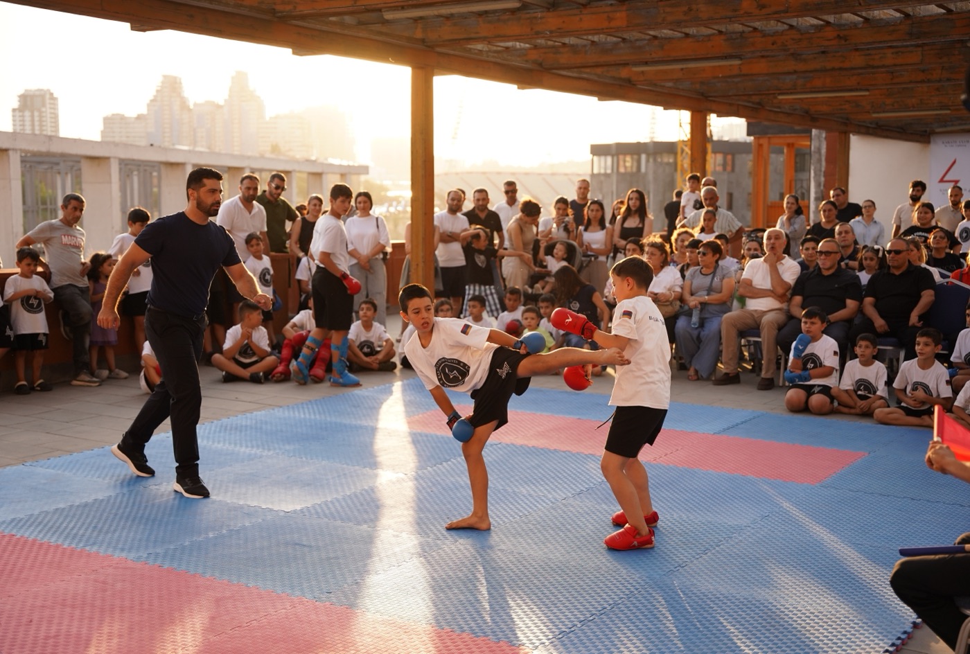 Outdoor sparring match in front of an audience