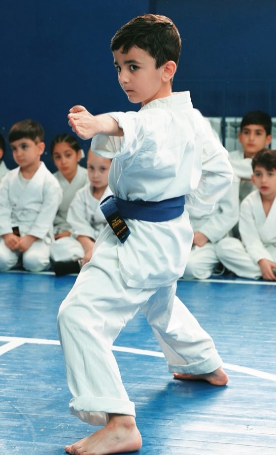 Blue-belt student at a tournament