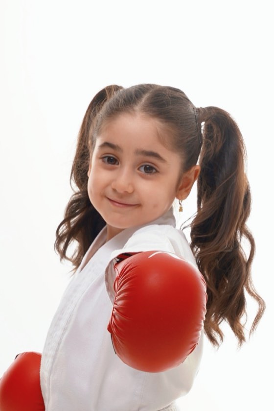 Smiling young girl with a glove